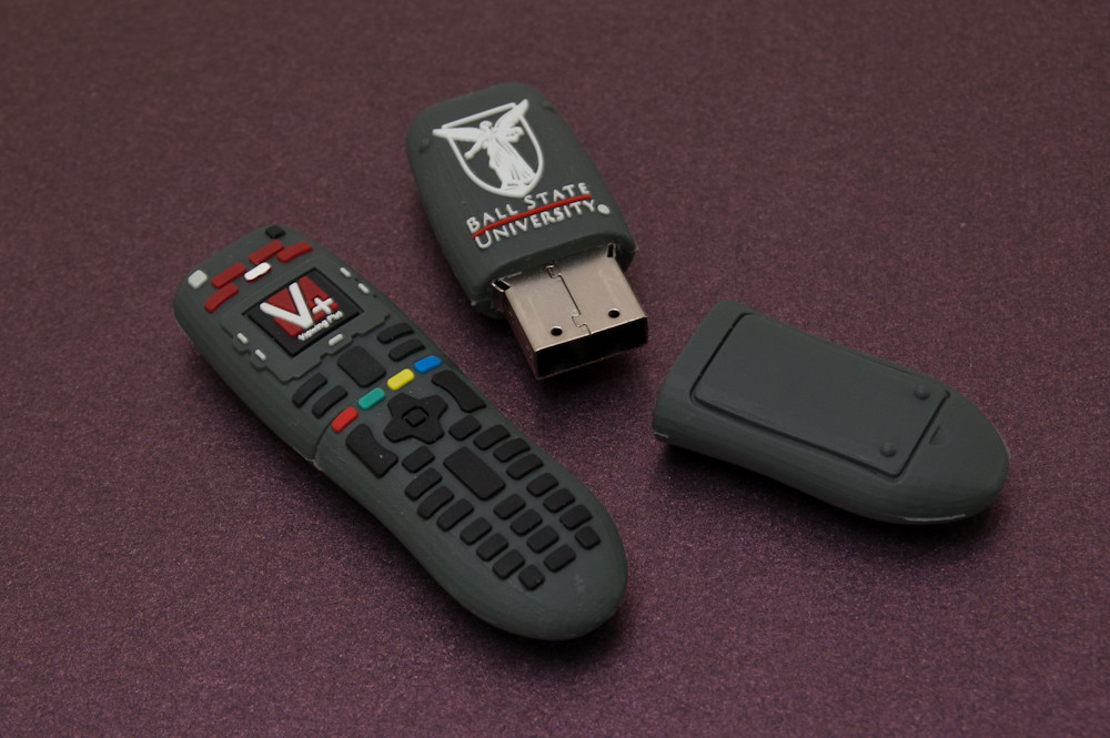 Amazon Firestick remote in front of a TV showing the best IPTV for Firestick channel guide