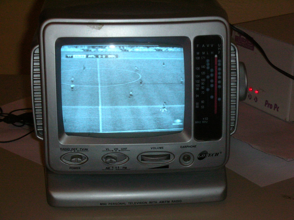 Person comparing legal IPTV streaming services on a smart TV