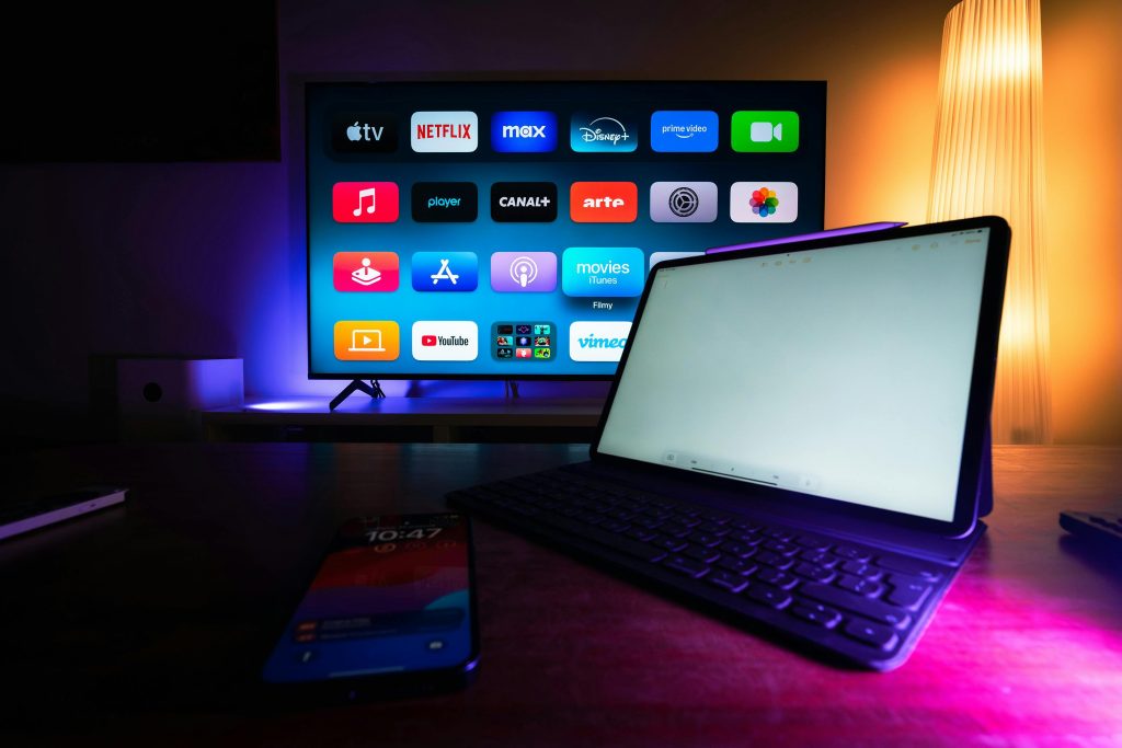 Smart TV and tablet showing streaming apps in a home entertainment setup